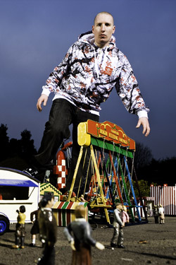 Danny Byrd promo photo - Danny looms over some buildings